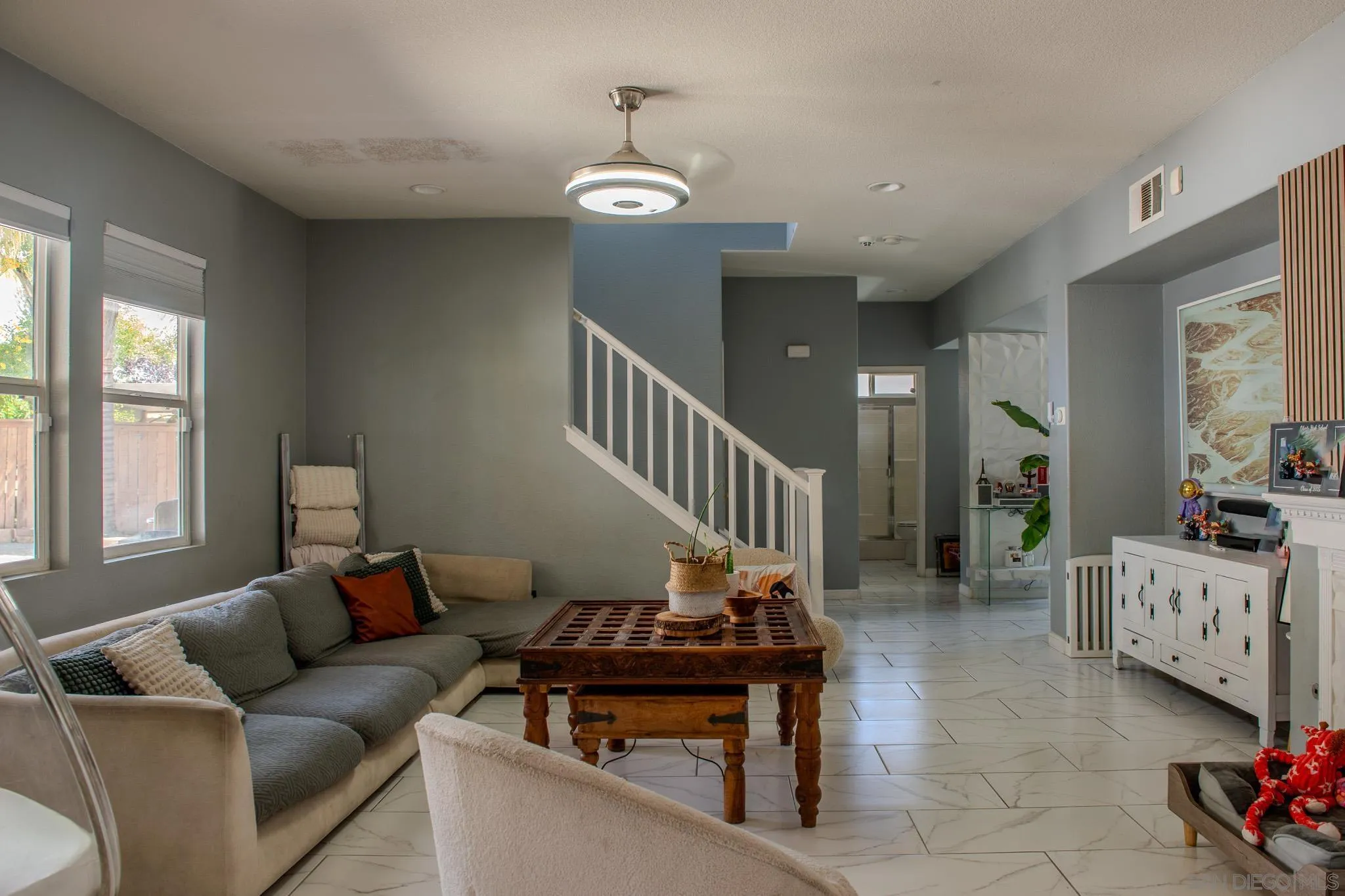 33567 Magnetite Street Menifee, CA 92584 - Photo 15 of 49 a living room with furniture and a chandelier