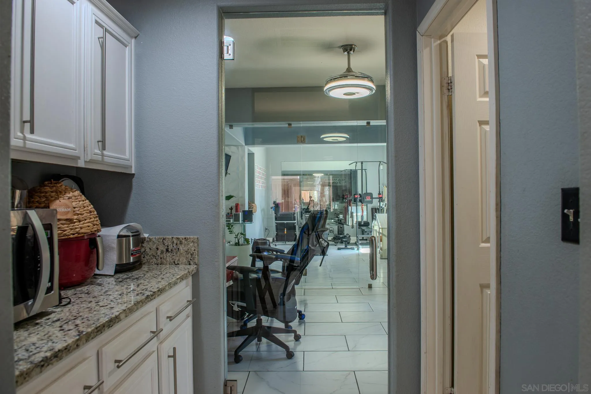 33567 Magnetite Street Menifee, CA 92584 - Photo 20 of 49 a kitchen with granite countertop a sink and cabinets