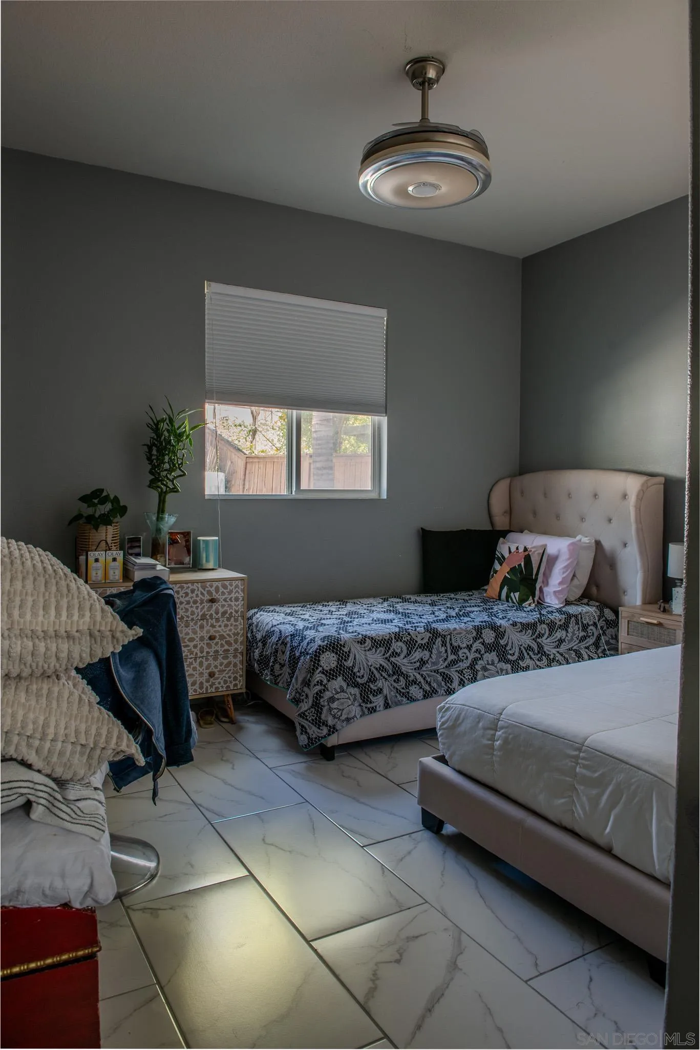 33567 Magnetite Street Menifee, CA 92584 - Photo 21 of 49 a bedroom with a bed and window