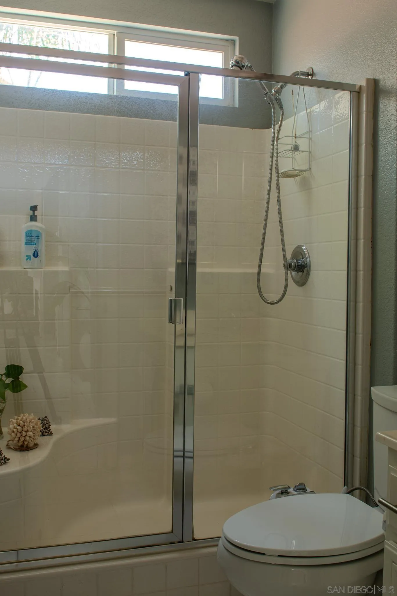 33567 Magnetite Street Menifee, CA 92584 - Photo 23 of 49 a bathroom with a shower and a toilet