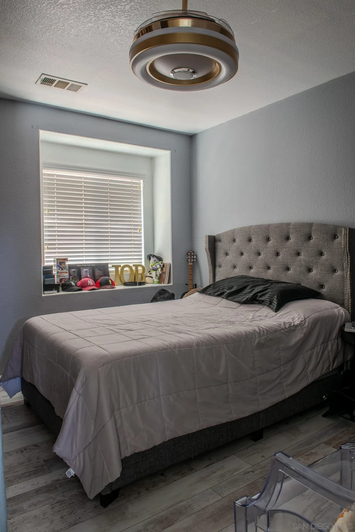 33567 Magnetite Street Menifee, CA 92584 - Photo 31 of 49 a bedroom with a bed and a mirror