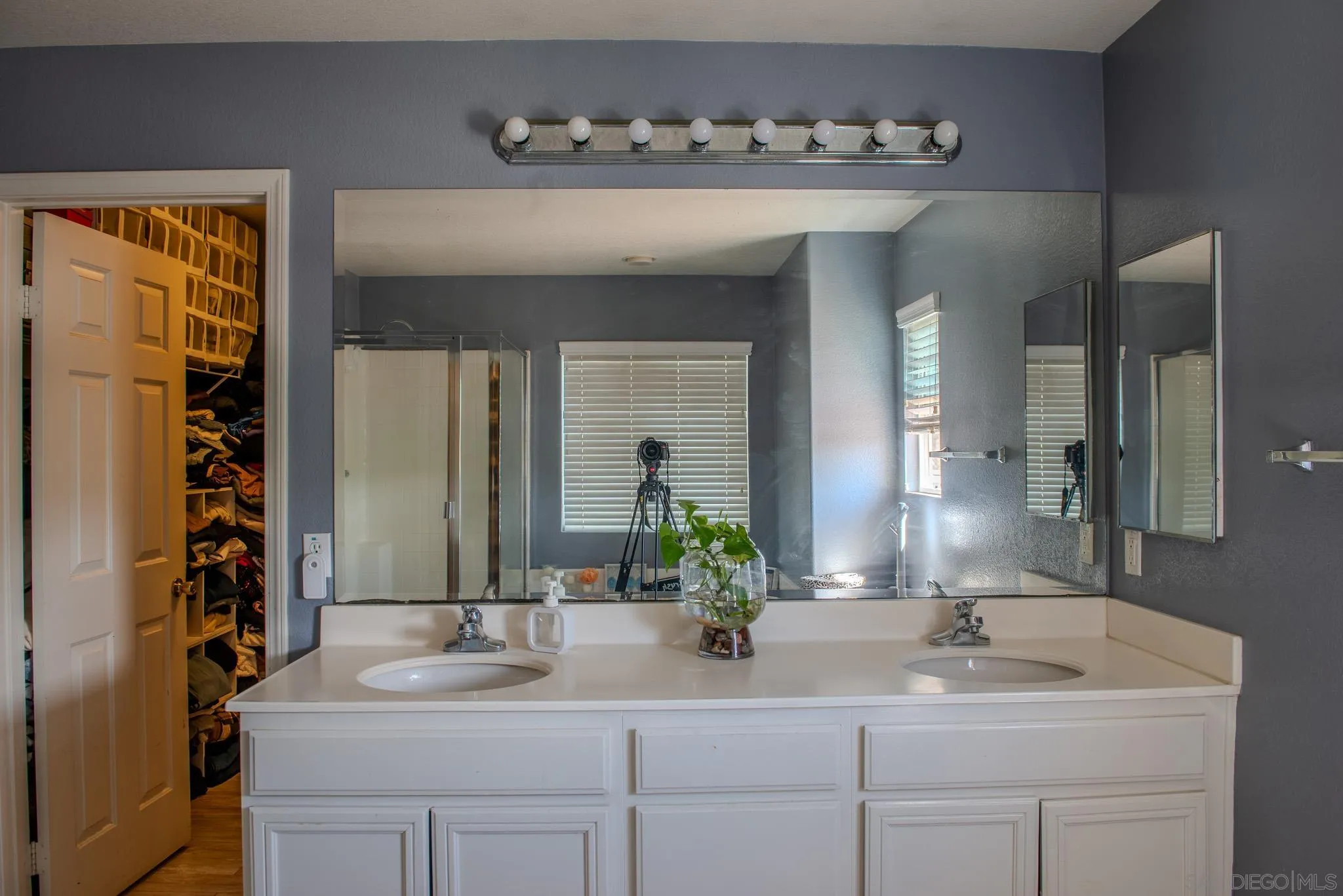 33567 Magnetite Street Menifee, CA 92584 - Photo 37 of 49 a bathroom with a sink and a mirror