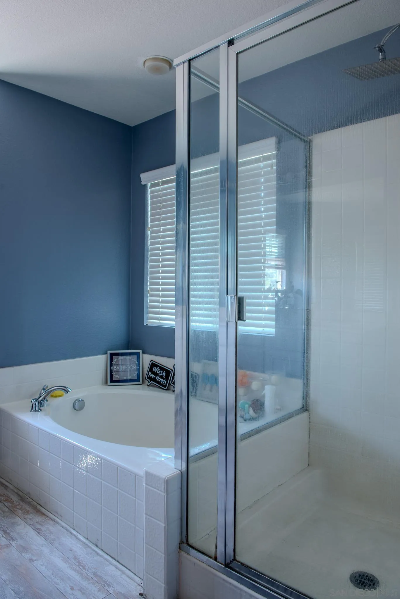 33567 Magnetite Street Menifee, CA 92584 - Photo 40 of 49 a bathroom with a tub and shower