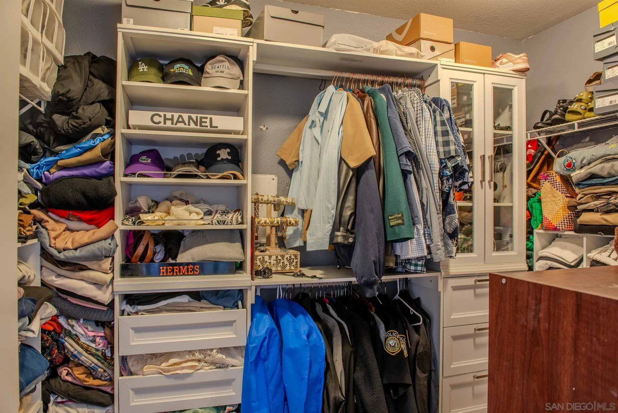 33567 Magnetite Street Menifee, CA 92584 - Photo 42 of 49 a view of walk in closet with clothes and shoes