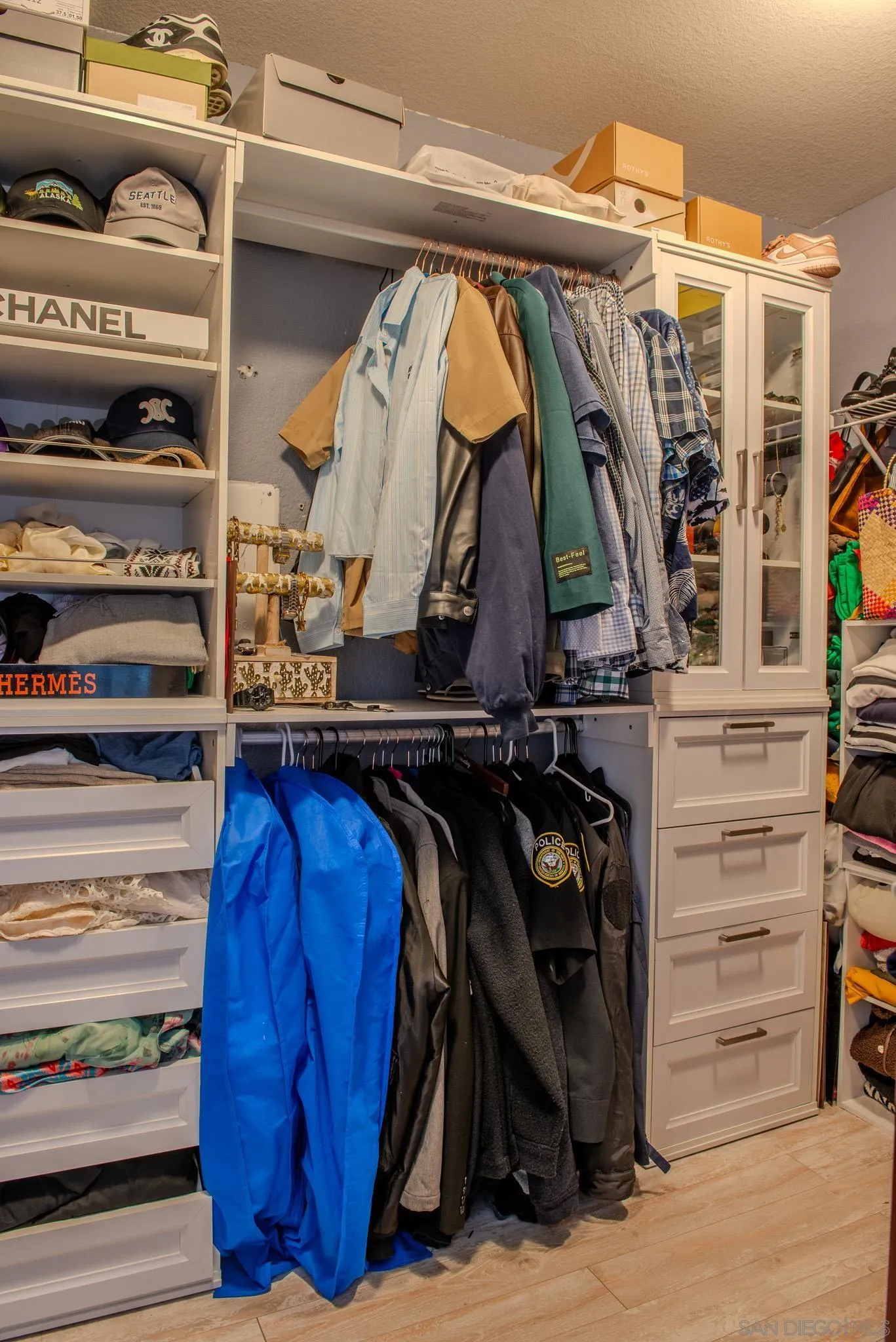 33567 Magnetite Street Menifee, CA 92584 - Photo 43 of 49 a view of walk in closet with clothes and shoes