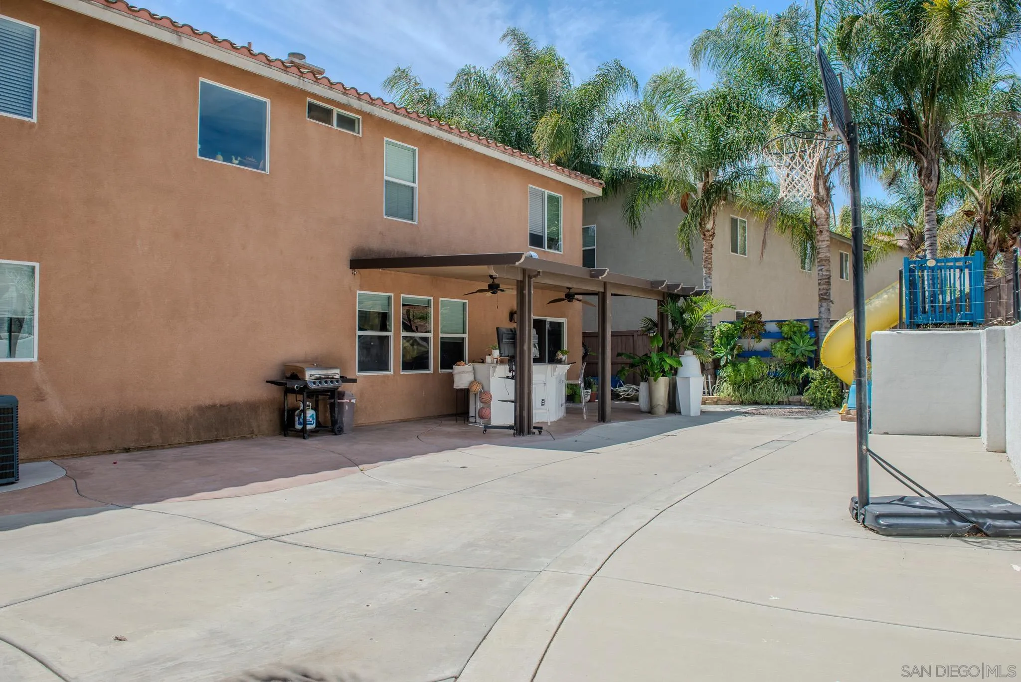 33567 Magnetite Street Menifee, CA 92584 - Photo 47 of 49 a view of a chair and tables in the patio