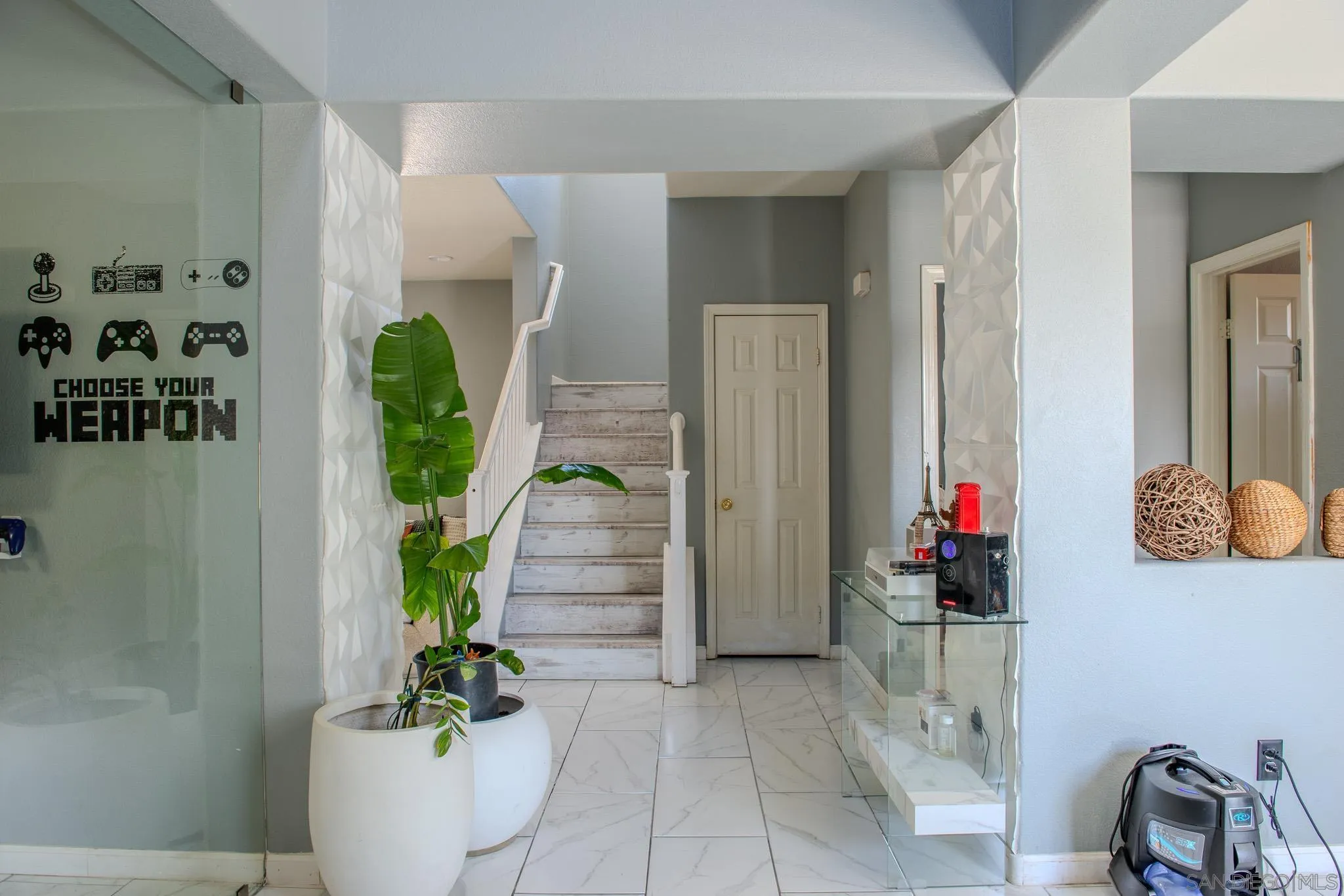 33567 Magnetite Street Menifee, CA 92584 - Photo 7 of 49 a room with potted plants in front of door