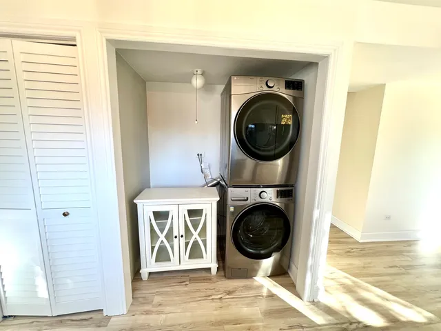 a view of a hallway with washer and dryer