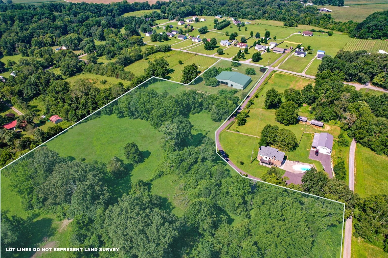 399 Jernigan Road Portland, TN 37148 - Photo 1 of 40 an aerial view of a house with a yard and greenery