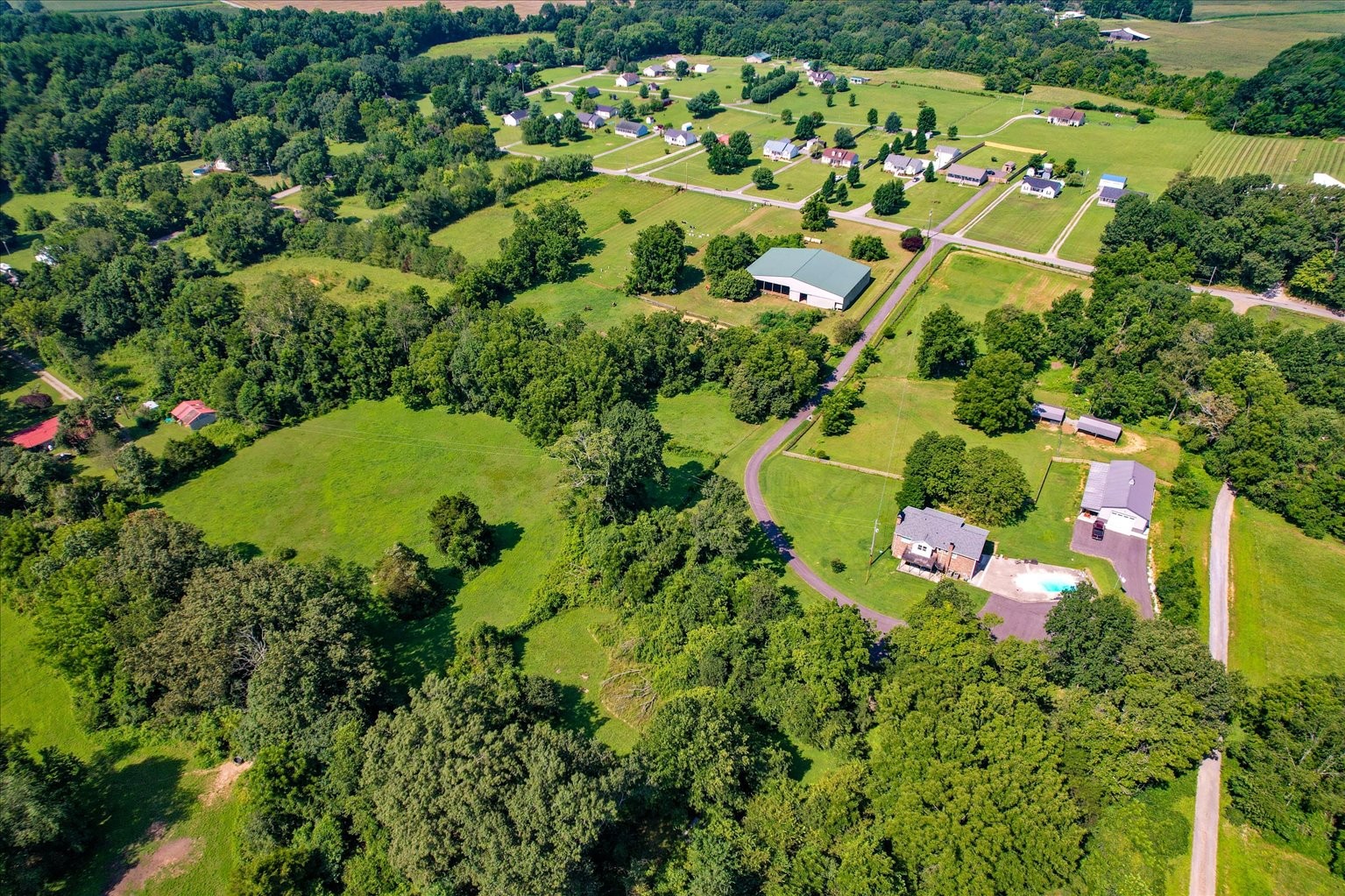 399 Jernigan Road Portland, TN 37148 - Photo 32 of 40 an aerial view of a residential houses with yard and swimming pool