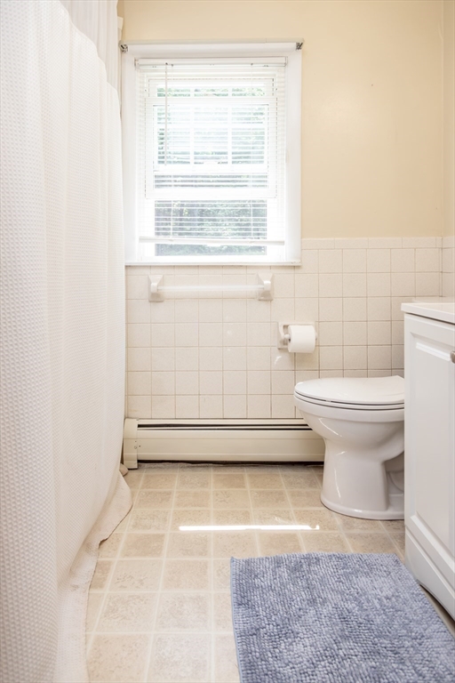 67 Hillside Road Montague, MA 01351 - Photo 11 of 26 a bathroom with a toilet a sink and a window