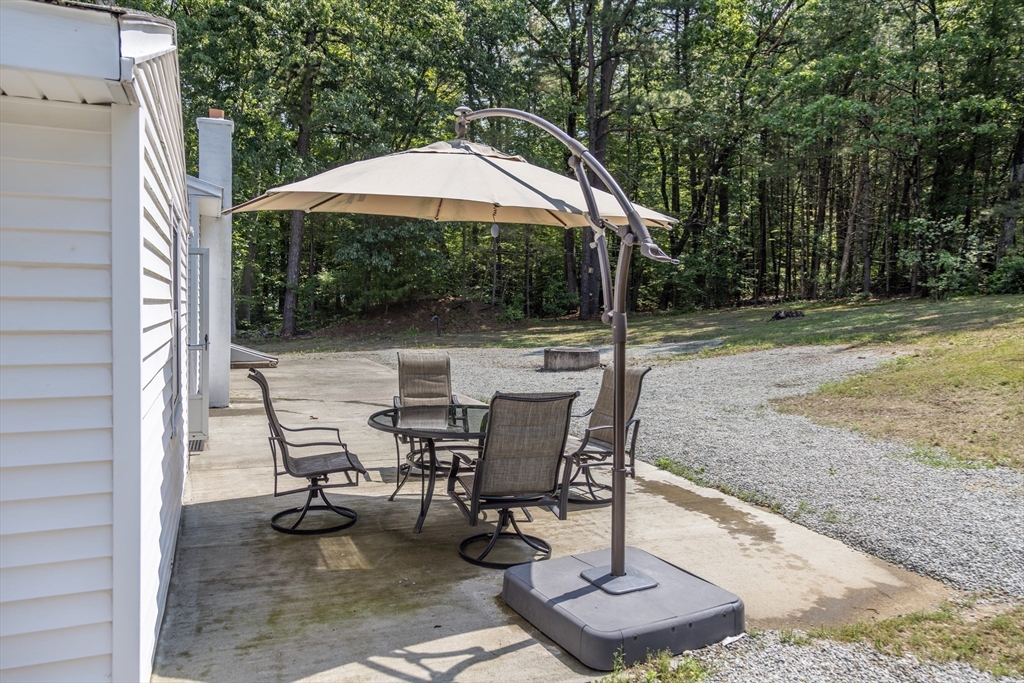 67 Hillside Road Montague, MA 01351 - Photo 20 of 26 a view of backyard with a patio and outdoor seating