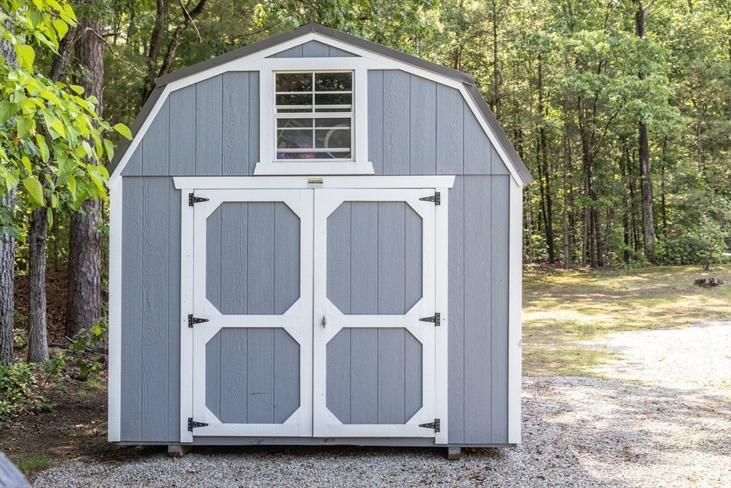 67 Hillside Road Montague, MA 01351 - Photo 24 of 26 a view of a house with backyard and trees
