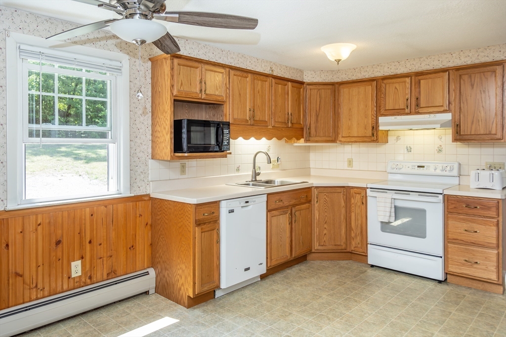 67 Hillside Road Montague, MA 01351 - Photo 6 of 26 a kitchen with granite countertop a sink stainless steel appliances and cabinets
