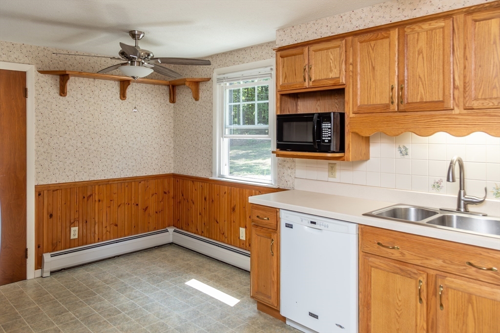 67 Hillside Road Montague, MA 01351 - Photo 9 of 26 a kitchen with a sink cabinets and a window