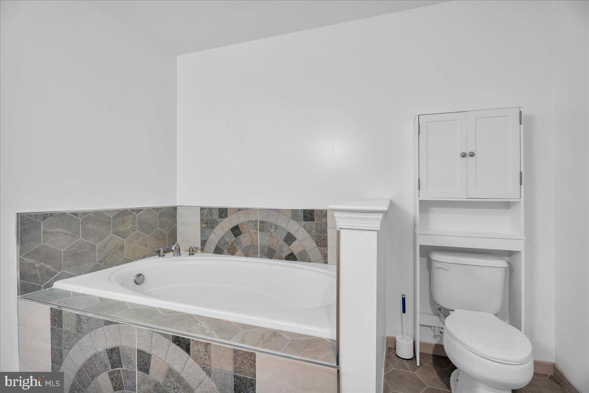 35 Beaumont Place Westampton, NJ 08060 - Photo 15 of 21 a white bath tub sitting next to a toilet
