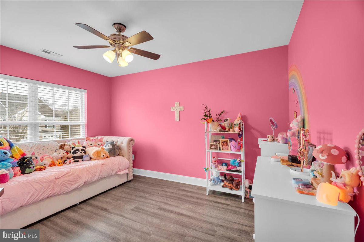 35 Beaumont Place Westampton, NJ 08060 - Photo 16 of 21 a bedroom with a bed and a chandelier