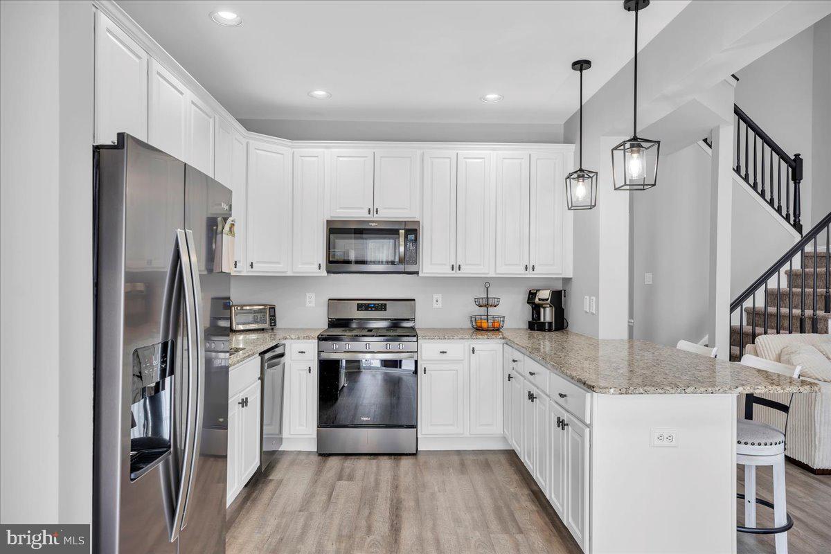 35 Beaumont Place Westampton, NJ 08060 - Photo 9 of 21 a kitchen with white cabinets stainless steel appliances and a island