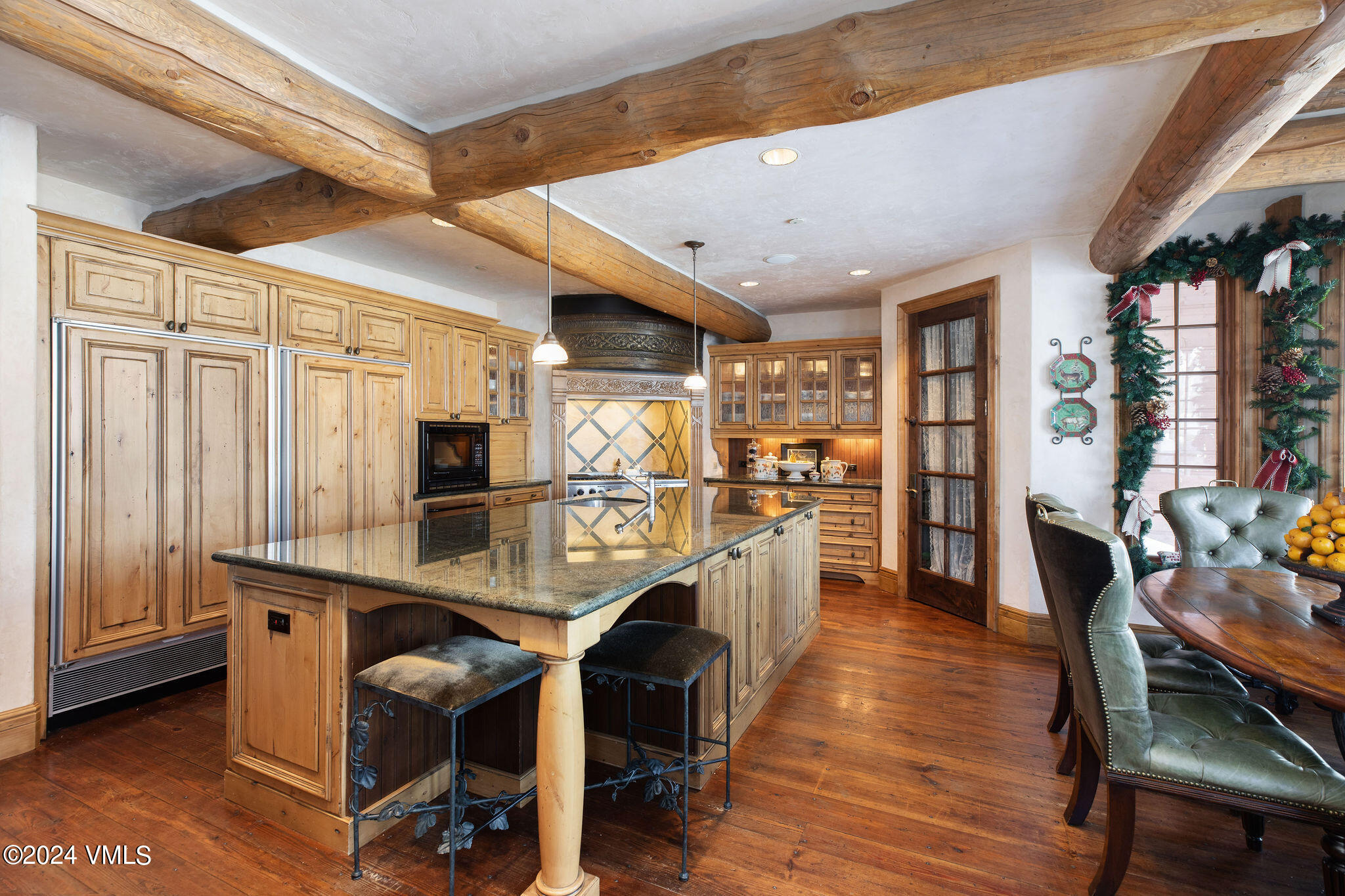 2187 Daybreak Ridge Road Avon, CO 81620 - Photo 15 of 40 a dining room with furniture and wooden floor