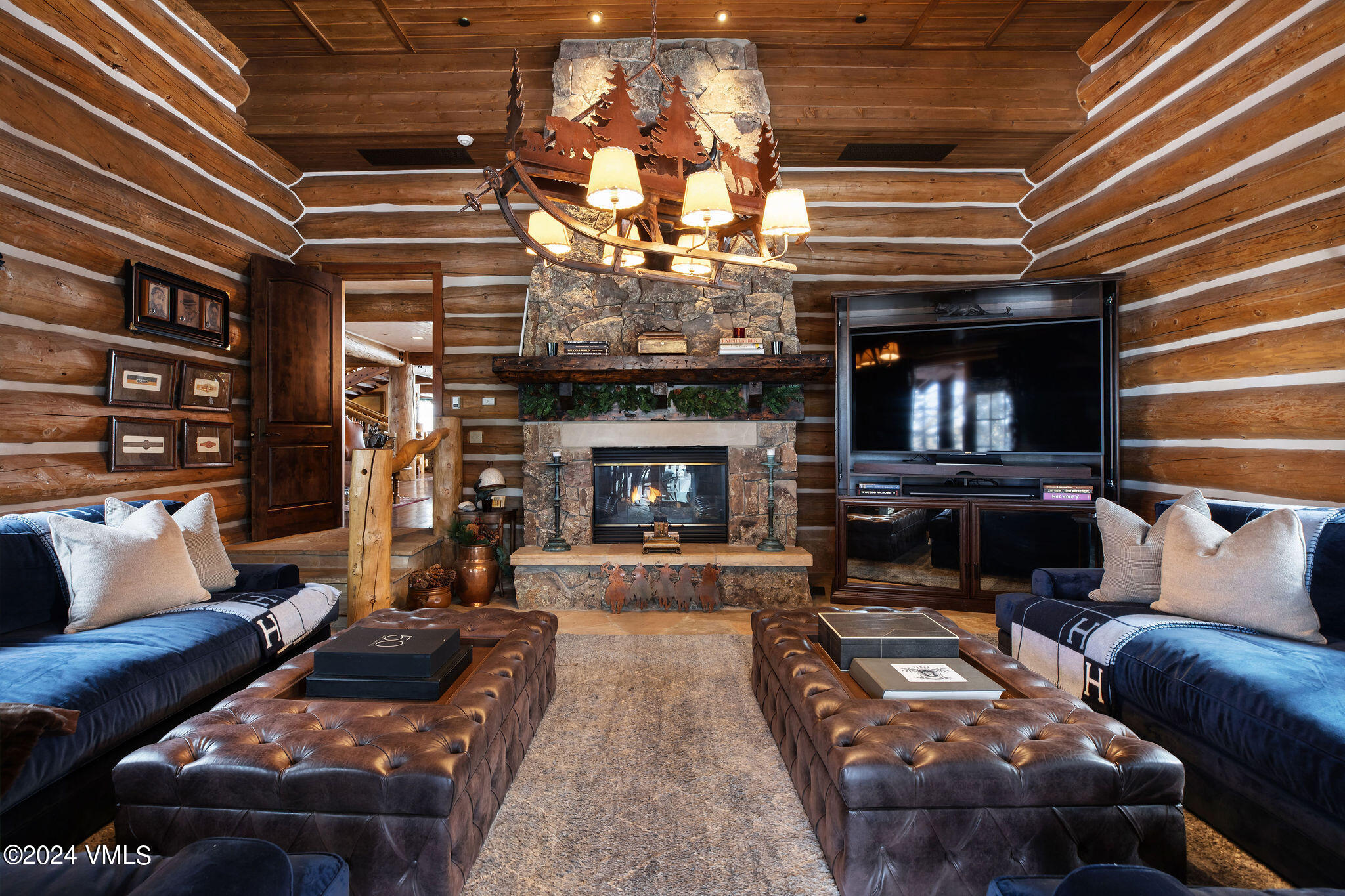 2187 Daybreak Ridge Road Avon, CO 81620 - Photo 16 of 40 a living room with furniture and a fireplace