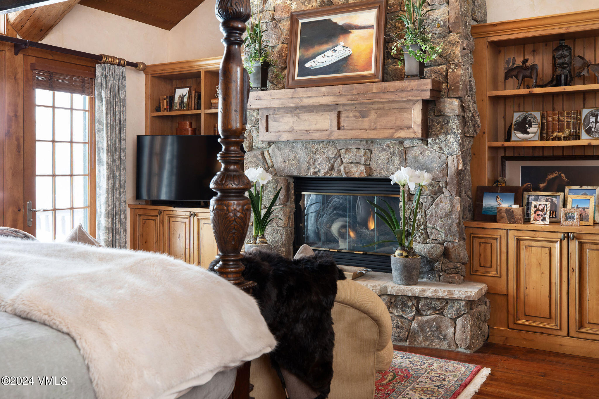 2187 Daybreak Ridge Road Avon, CO 81620 - Photo 18 of 40 a living room with furniture and a fireplace