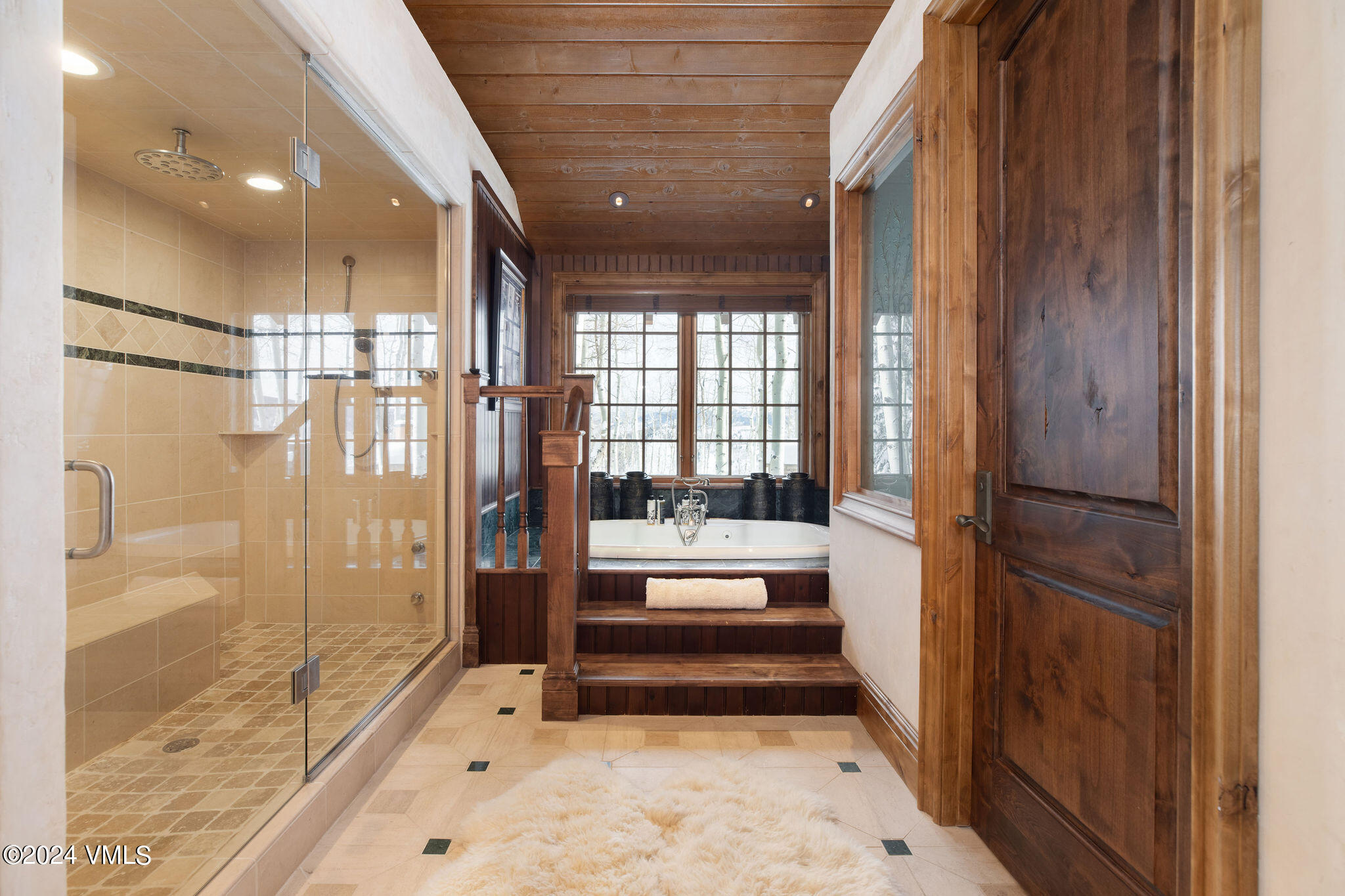 2187 Daybreak Ridge Road Avon, CO 81620 - Photo 20 of 40 a bathroom with a tub and shower