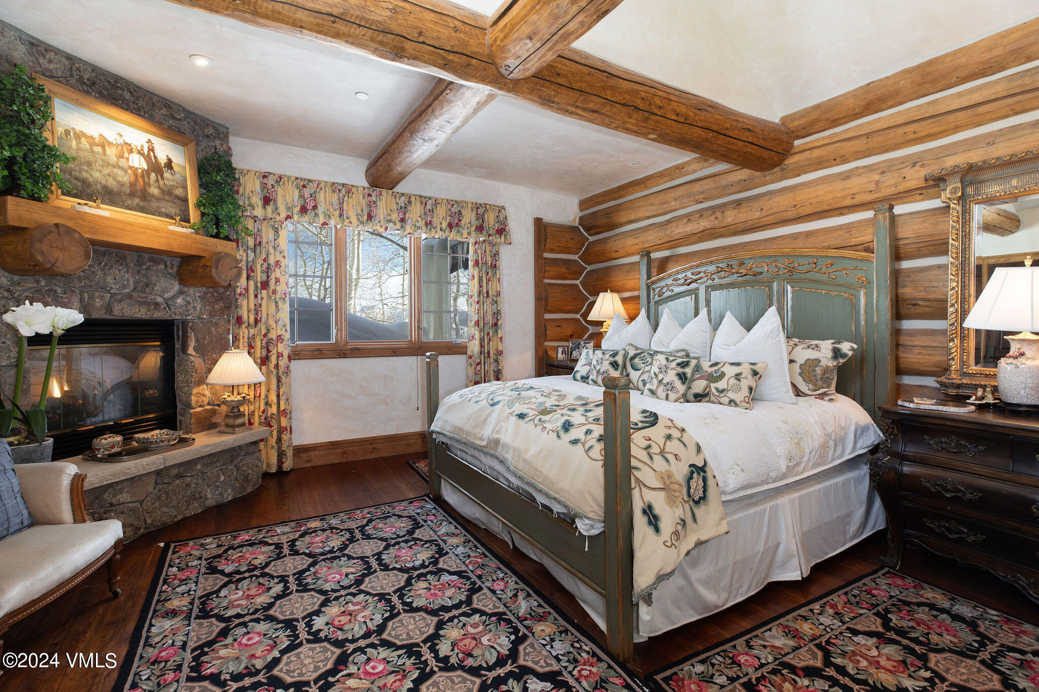 2187 Daybreak Ridge Road Avon, CO 81620 - Photo 25 of 40 a bed room with a bed and a fireplace