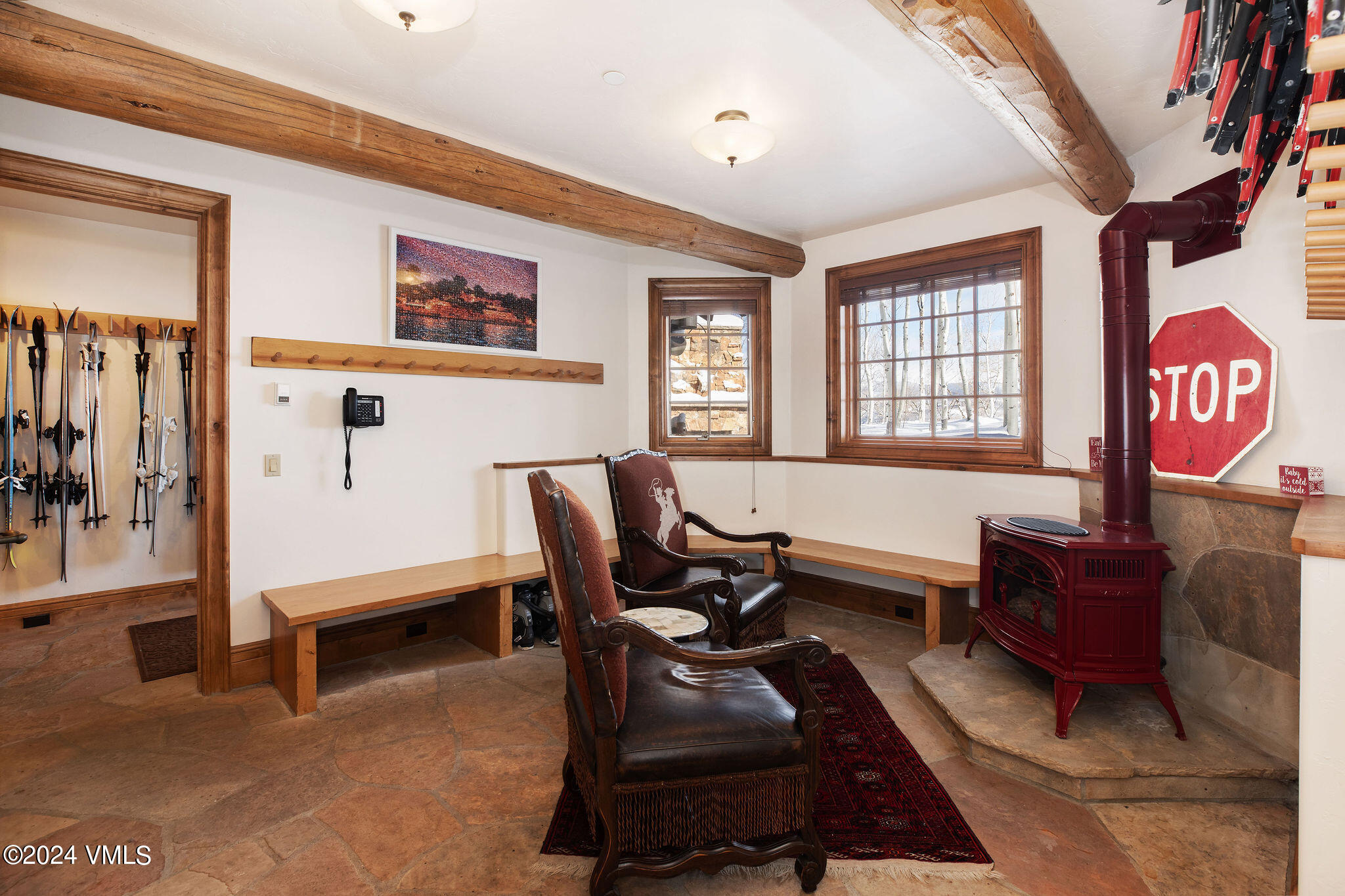 2187 Daybreak Ridge Road Avon, CO 81620 - Photo 26 of 40 a living room with furniture gym equipment and a window