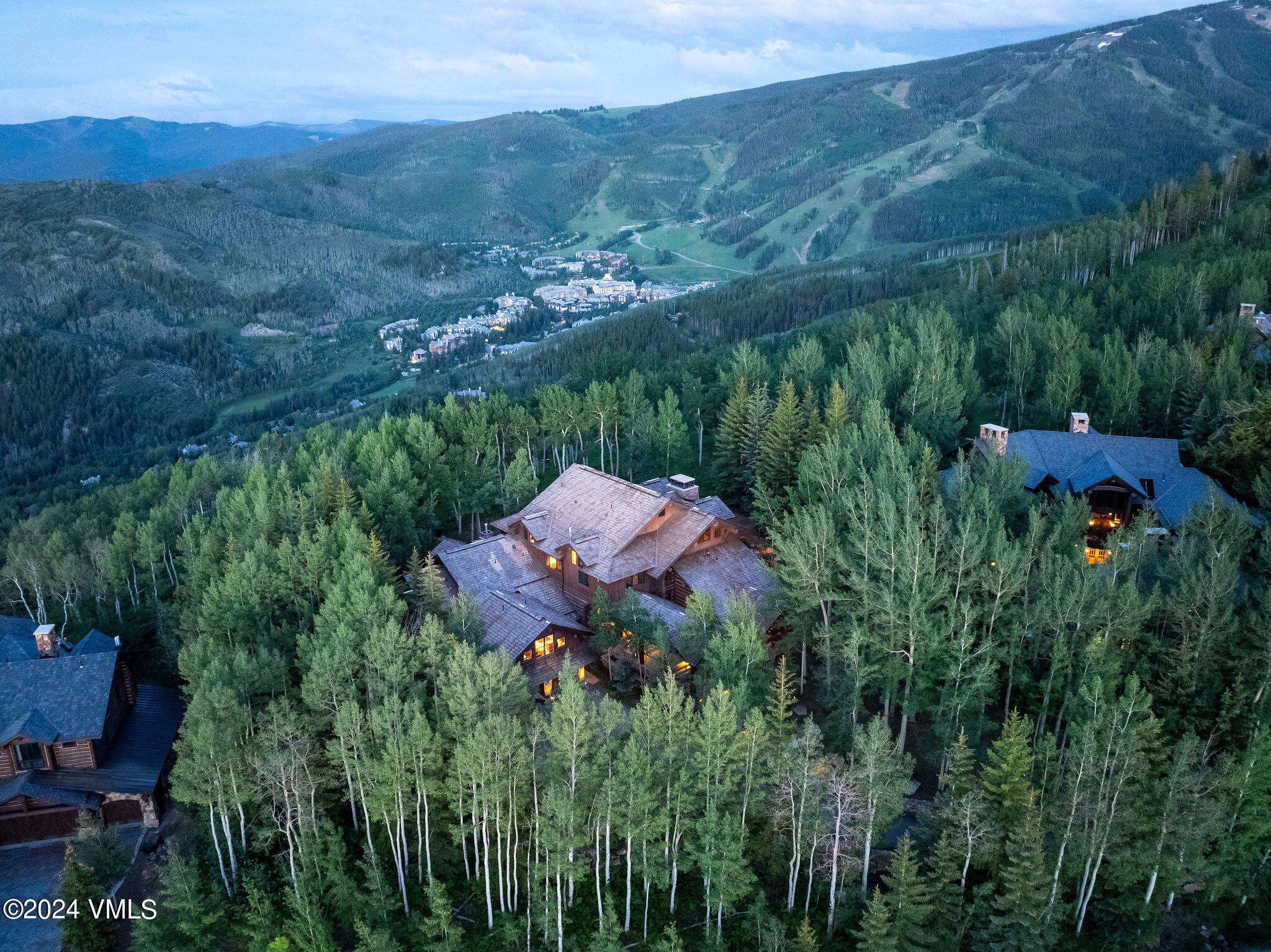 2187 Daybreak Ridge Road Avon, CO 81620 - Photo 3 of 40 a view of a lush green forest with mountains in the background