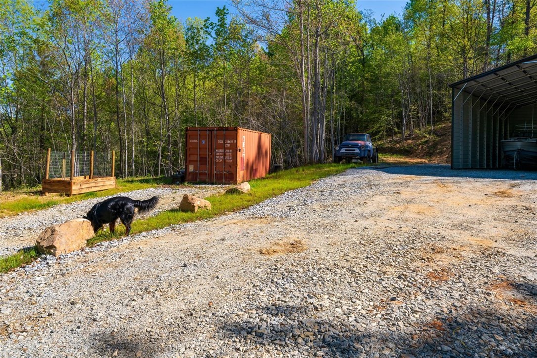 280 Dan Ross Road Six Mile, SC 29682 - Photo 3 of 24 This property features a spacious gravel driveway, offering ample parking and accessibility.