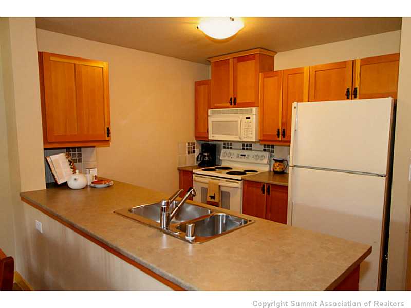 Kitchen. Kitchen comes with a 4 piece GE appliance package and purchase includes all pots, pans, dish-silver-flat ware and small kitchen appliances like toaster, coffee maker, blender ETC.