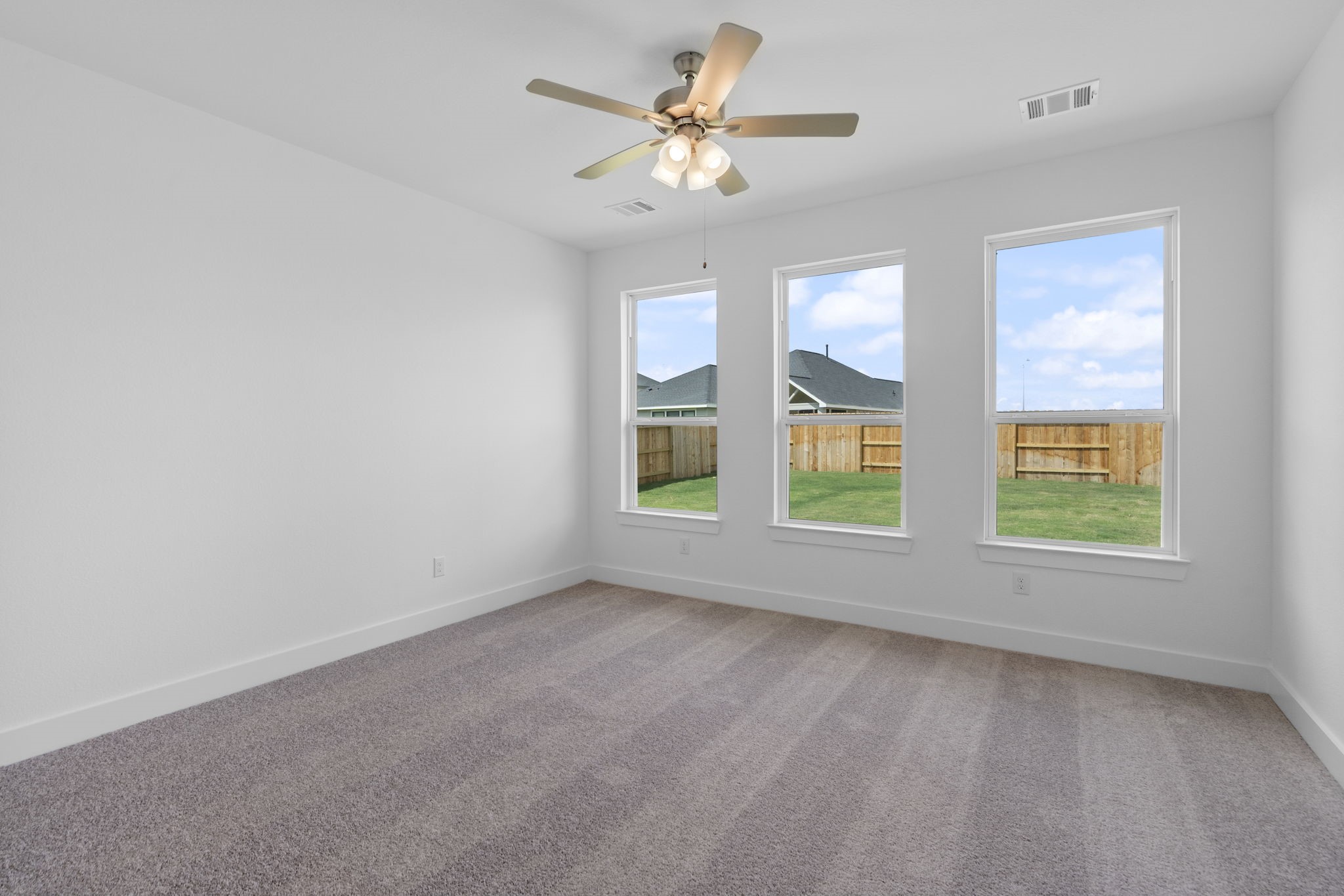 225 Sandhill Grv Trail Hempstead, TX 77445 - Photo 9 of 27 a view of an empty room with a window