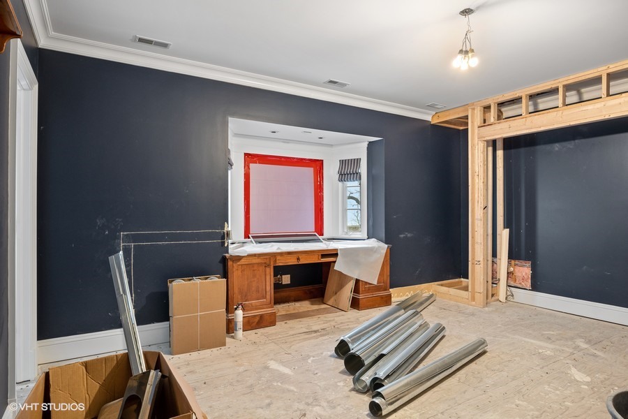 889 Sheridan Road Winnetka, IL 60093 - Photo 11 of 37 a bedroom with furniture and a window