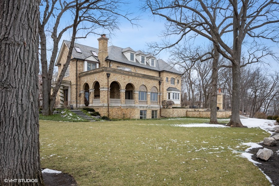889 Sheridan Road Winnetka, IL 60093 - Photo 23 of 37 a view of a white house with a large tree
