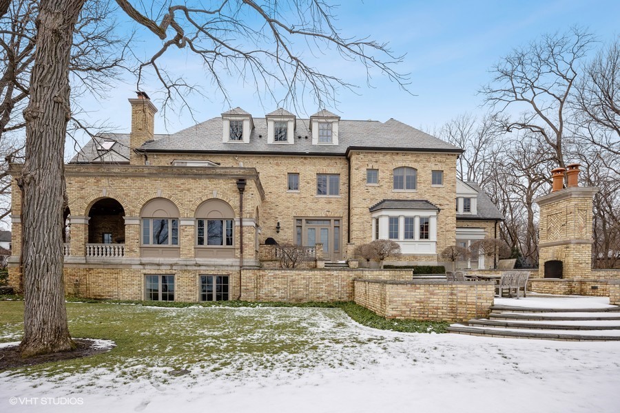 889 Sheridan Road Winnetka, IL 60093 - Photo 24 of 37 a front view of a house with a yard