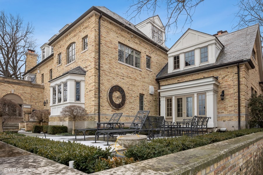 889 Sheridan Road Winnetka, IL 60093 - Photo 25 of 37 a view of a house with a yard and plants
