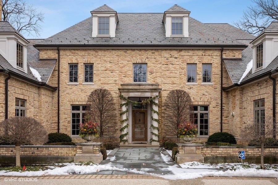 889 Sheridan Road Winnetka, IL 60093 - Photo 3 of 37 a front view of a house with garden