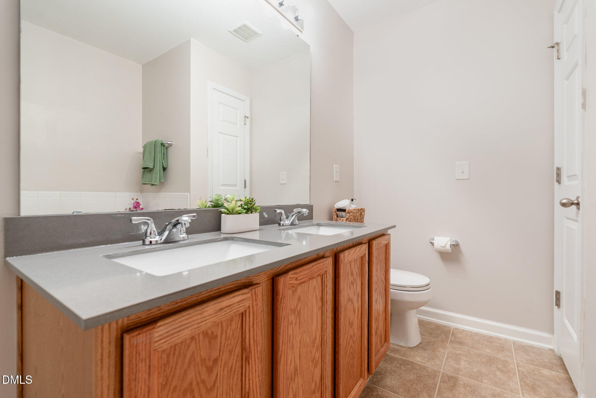 311 Gilman Lane, Unit 107 Raleigh, NC 27610 - Photo 17 of 21 a bathroom with a sink and a mirror