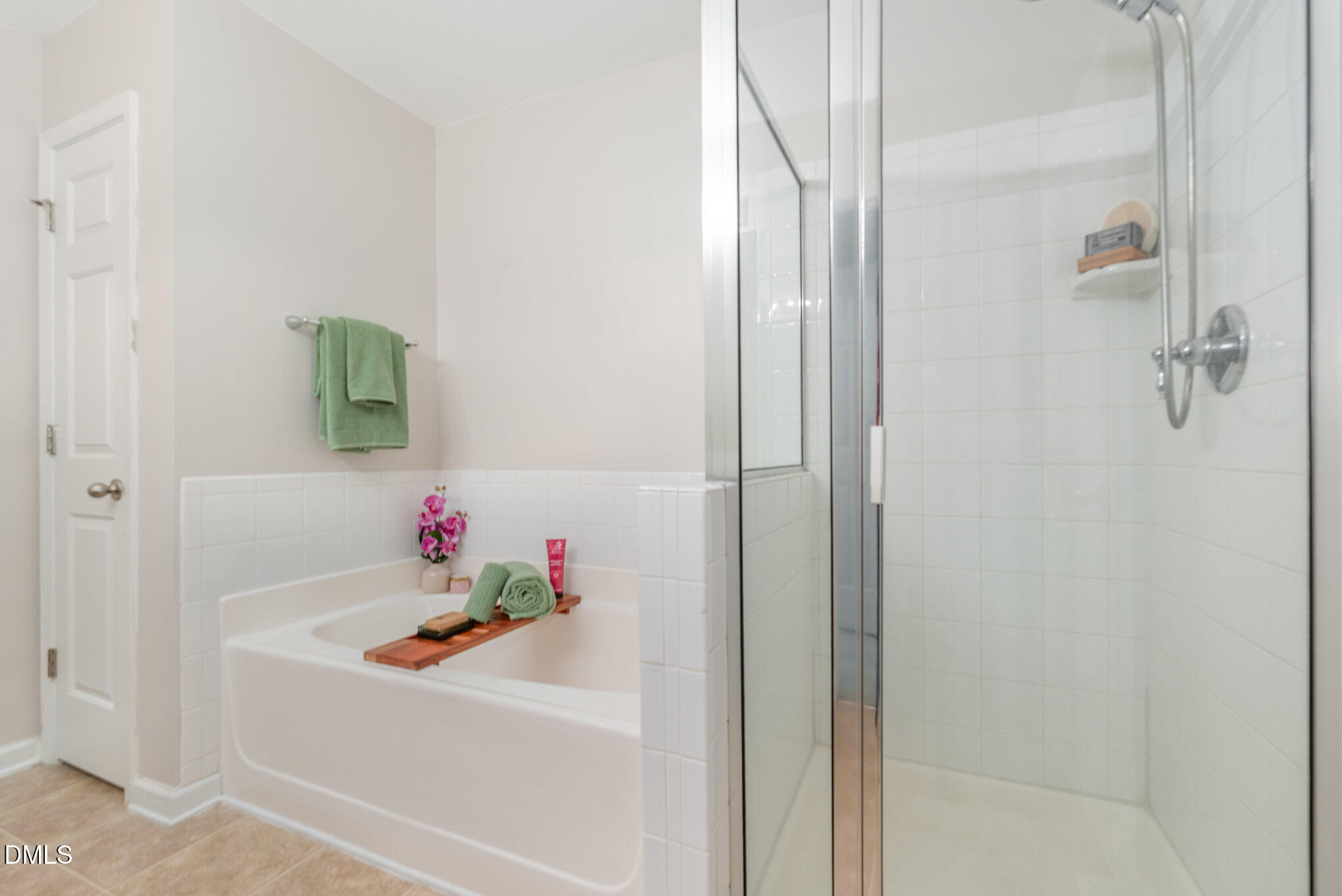 311 Gilman Lane, Unit 107 Raleigh, NC 27610 - Photo 18 of 21 a bathroom with a sink and a shower