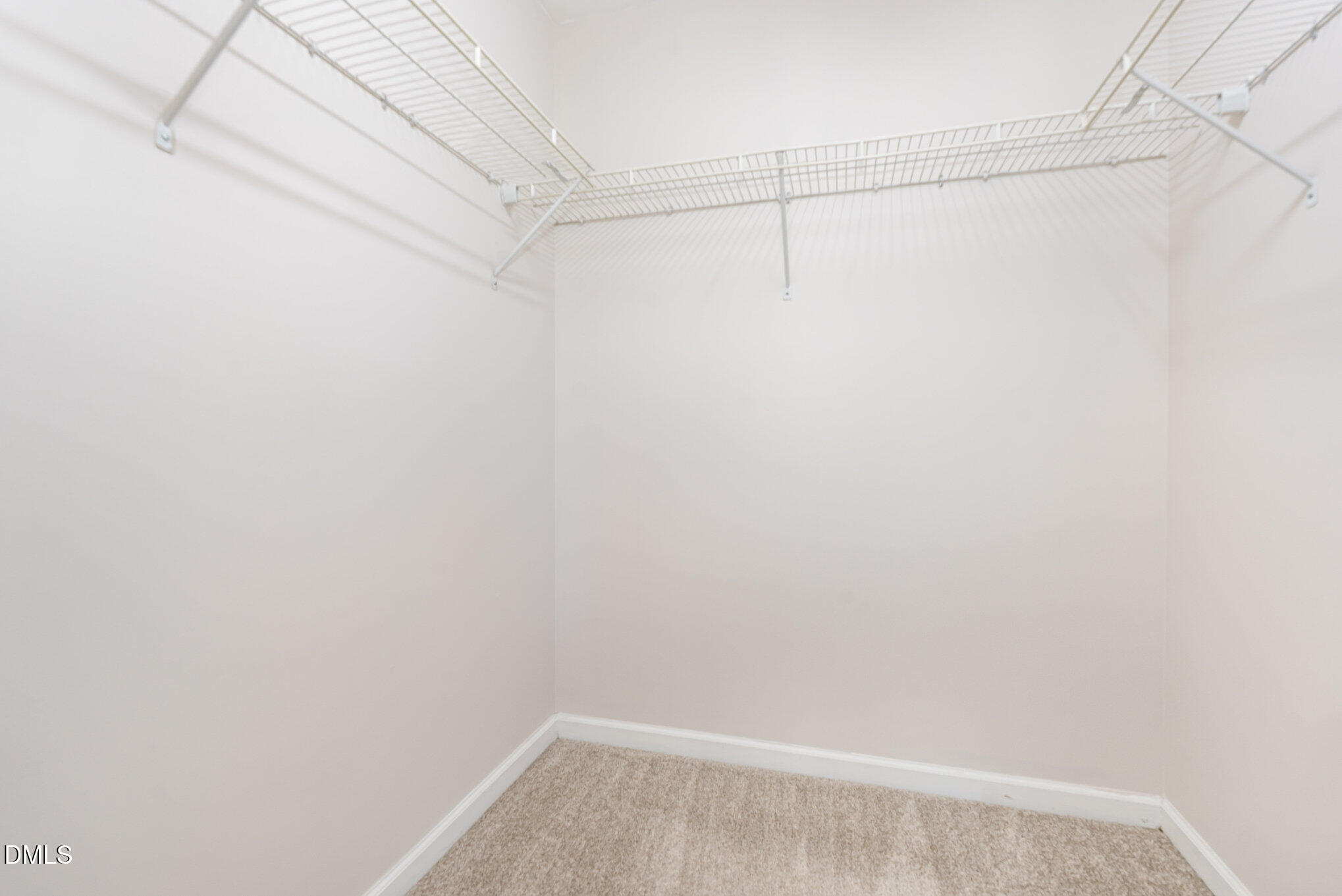 311 Gilman Lane, Unit 107 Raleigh, NC 27610 - Photo 19 of 21 a view of a room with racks on the wall