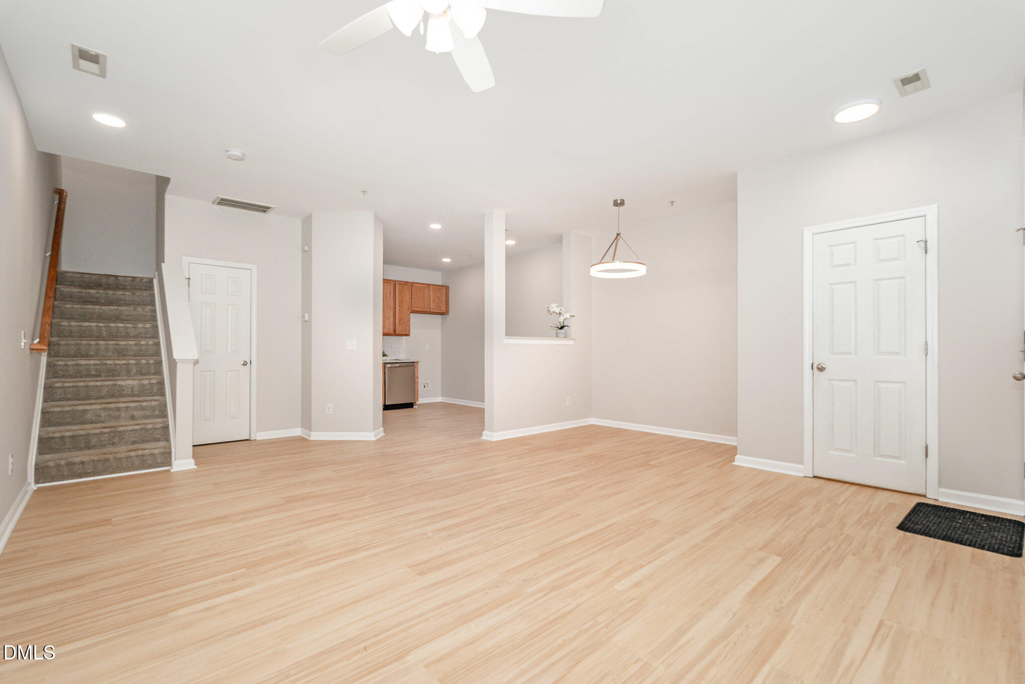 311 Gilman Lane, Unit 107 Raleigh, NC 27610 - Photo 2 of 21 wooden floor in an empty room with a window