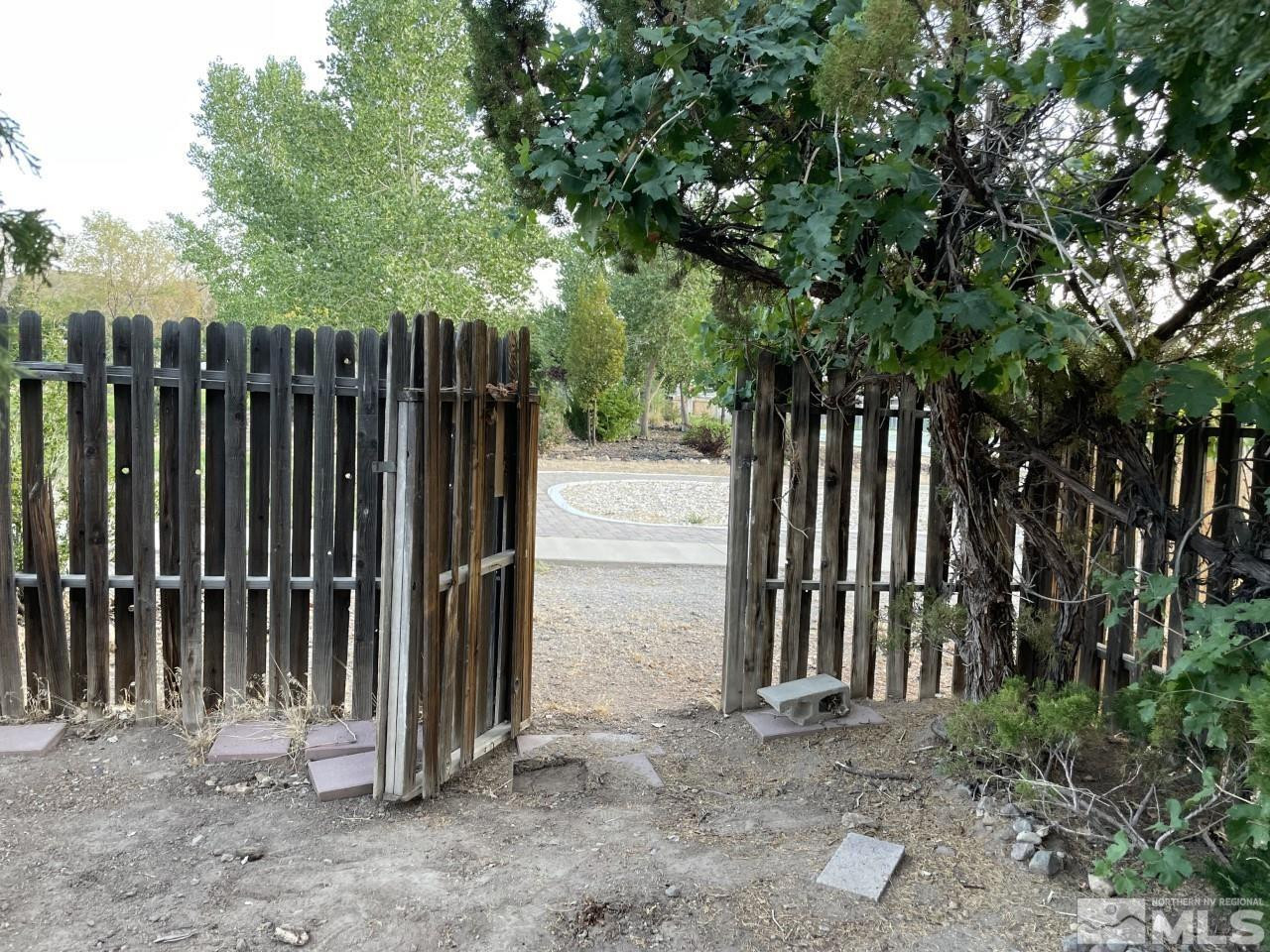 16160 Rhyolite Circle Reno, NV 89521 - Photo 12 of 14 a view of a backyard with wooden fence