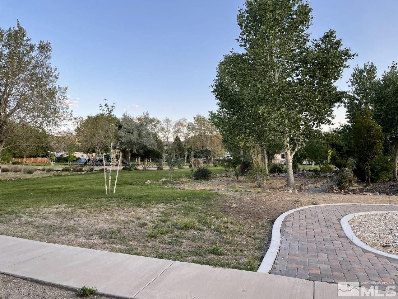 16160 Rhyolite Circle Reno, NV 89521 - Photo 13 of 14 a backyard of a house with trees and outdoor seating
