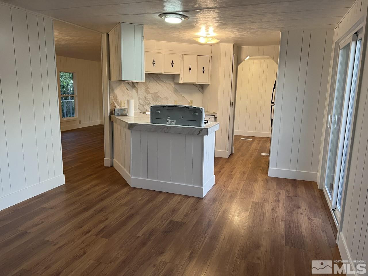 16160 Rhyolite Circle Reno, NV 89521 - Photo 4 of 14 a kitchen with stainless steel appliances granite countertop a refrigerator and a stove top oven