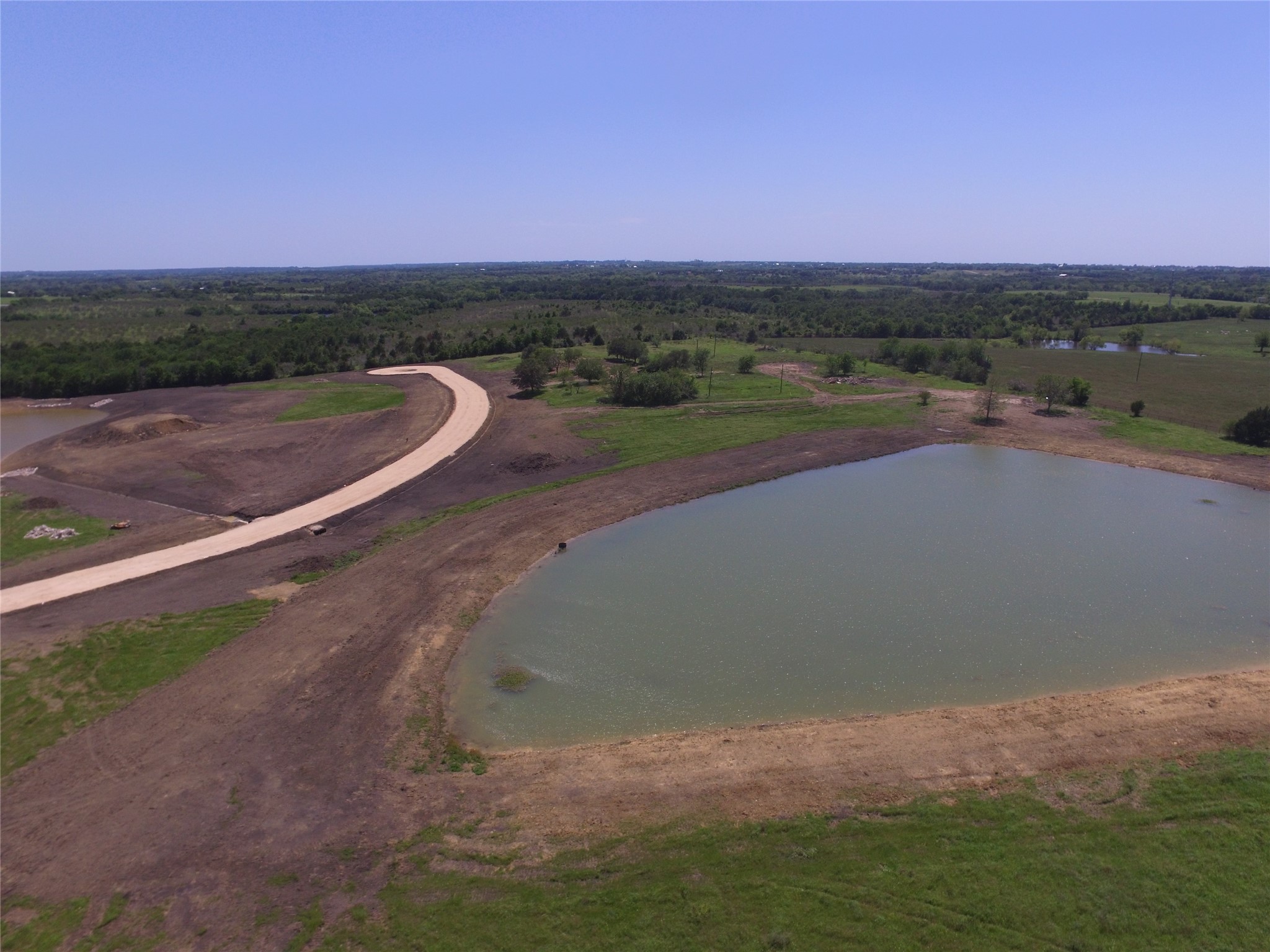 Lot 1 Jozwiak Road Chappell Hill, TX 77426 - Photo 6 of 9 a view of a lake with sunset