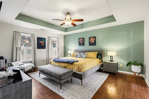 a bedroom with a bed couch and window