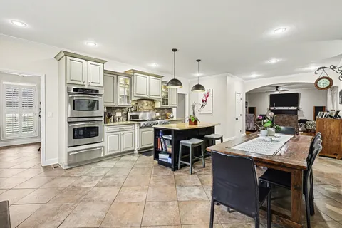 a kitchen with a sink stainless steel appliances and cabinets