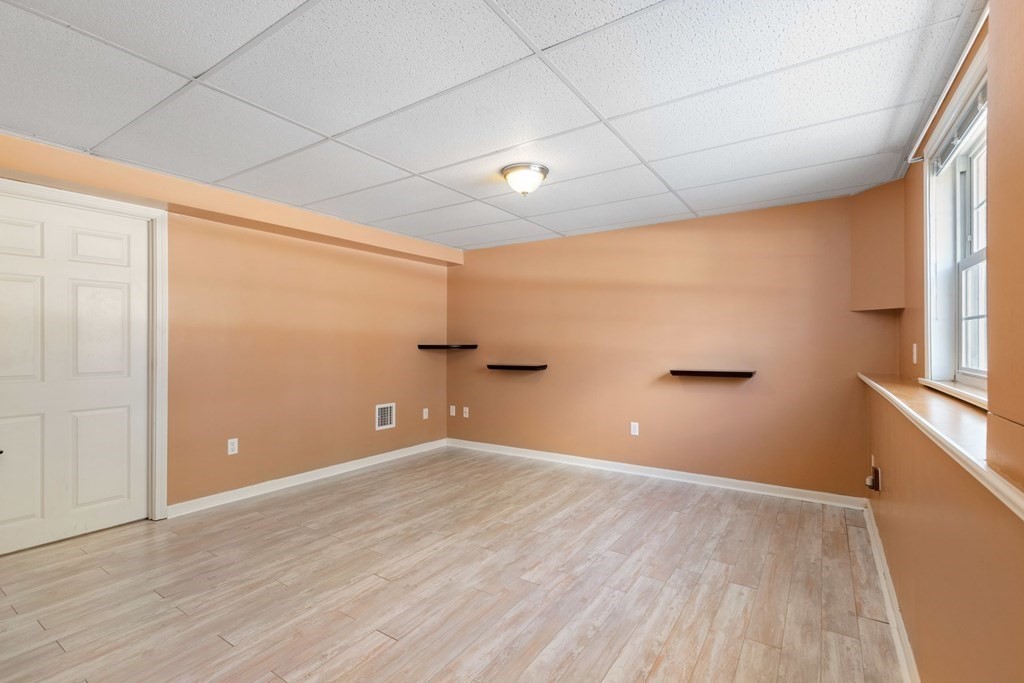 20 Hemlock Circle, Unit 20 Millis, MA 02054 - Photo 18 of 27 a view of empty room with wooden floor