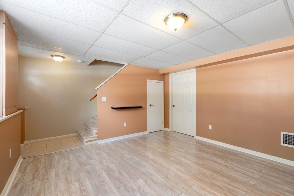 20 Hemlock Circle, Unit 20 Millis, MA 02054 - Photo 19 of 27 a view of a big room with wooden floor and windows