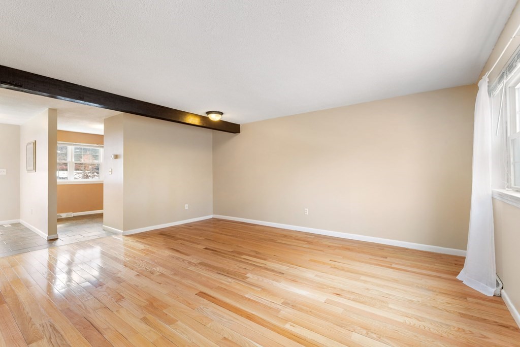 20 Hemlock Circle, Unit 20 Millis, MA 02054 - Photo 2 of 27 a view of an empty room and wooden floor